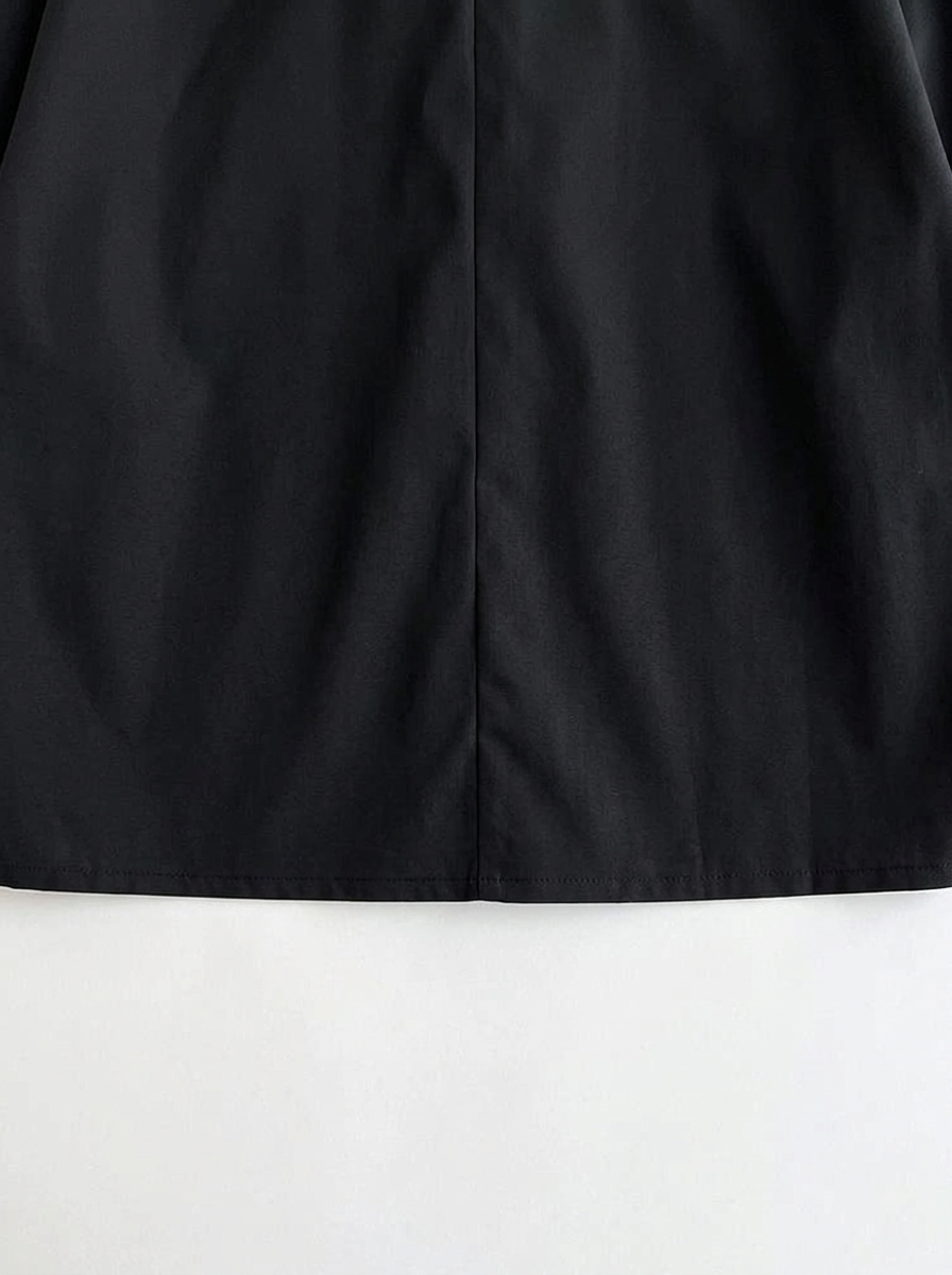 Black · detail · center-back seam and hem