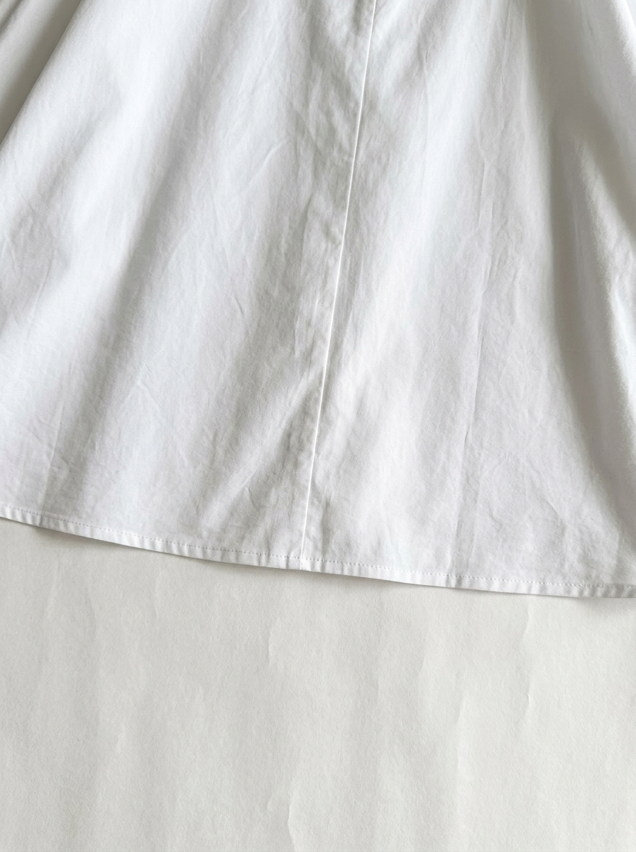 White · detail · center-back seam and hem